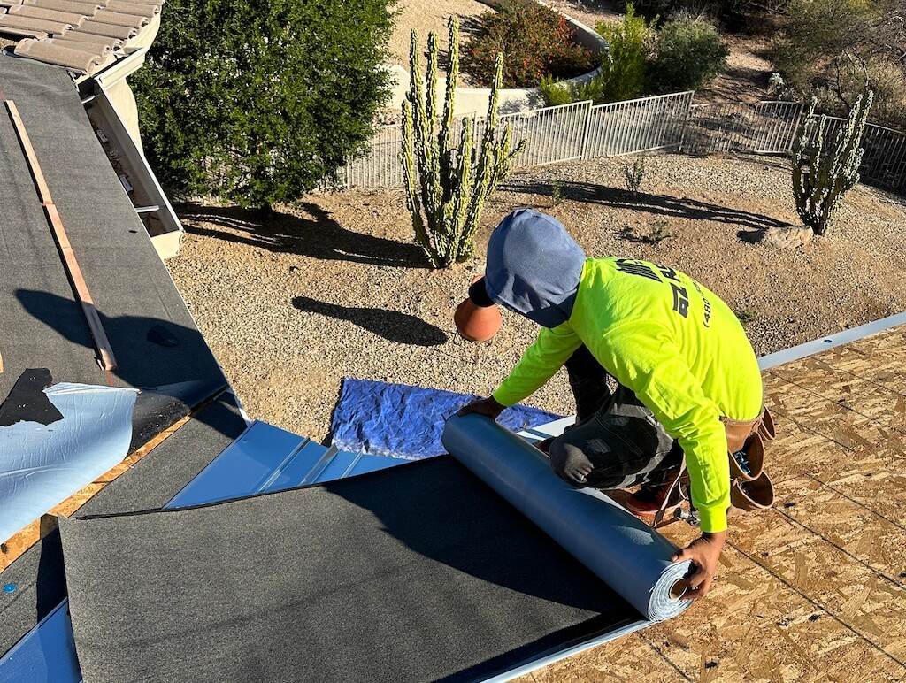 A roofing contractor performing common repairs on a roof.