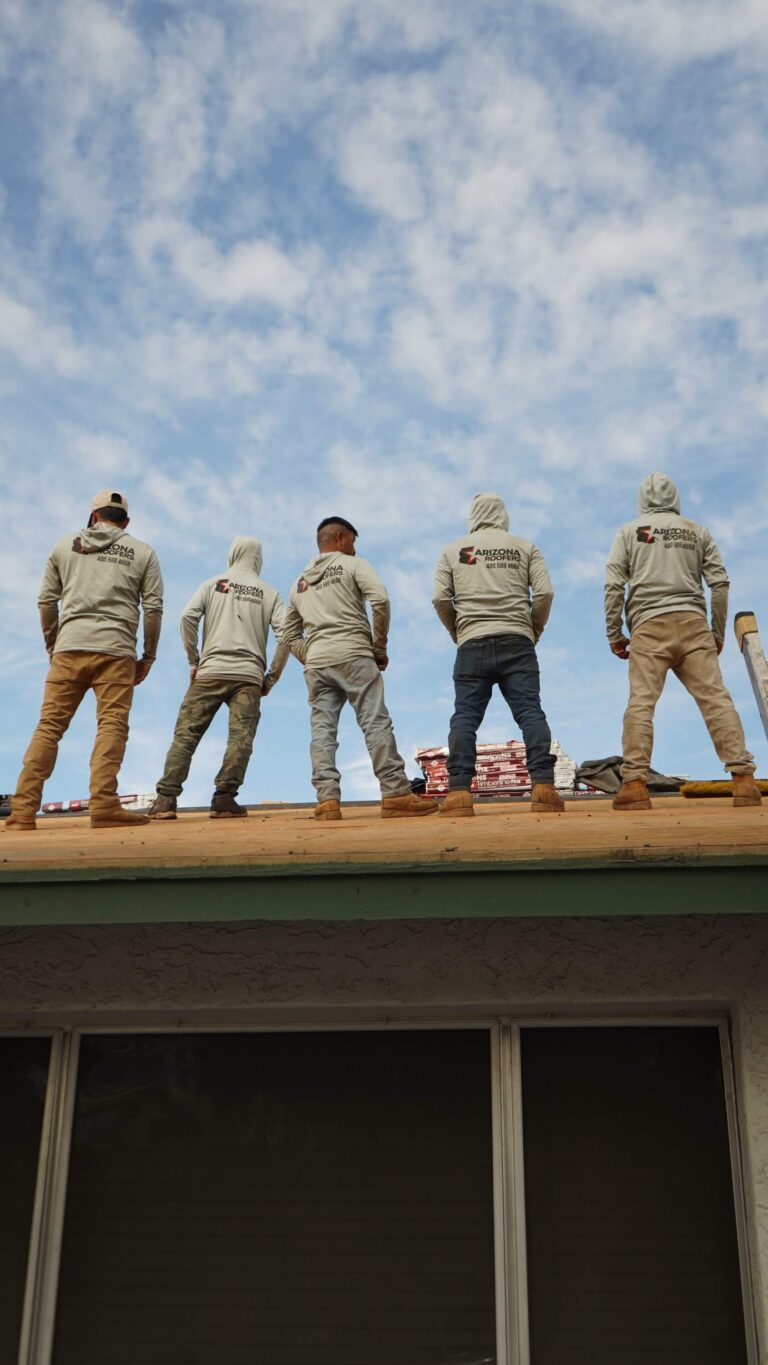 Arizona Roofers crew standing on a residential roof