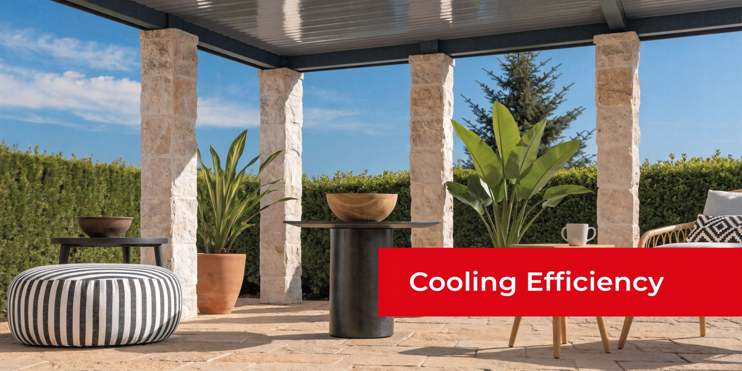 A modern outdoor covered patio with stone pillars, a metal roof, plants, and stylish furniture pieces.